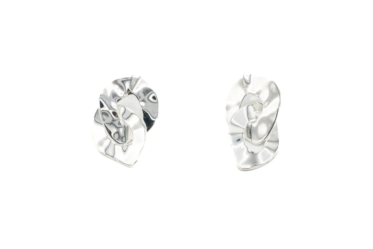 Pair of modern silver earrings with textured double ring design on white background